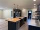 Modern kitchen featuring a wood island, stainless appliances, and sleek design, ideal for cooking and entertaining at 258 Riverwood Dr, Noblesville, IN 46062