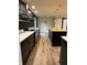 Spacious kitchen featuring black cabinetry, a butcher block island, and stainless steel appliances at 258 Riverwood Dr, Noblesville, IN 46062