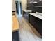 Bright kitchen with black cabinets, butcher block island and stainless steel appliances at 258 Riverwood Dr, Noblesville, IN 46062