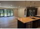 Spacious kitchen with a wood-topped island, stainless steel appliances, and open layout to living area at 258 Riverwood Dr, Noblesville, IN 46062