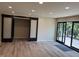 Bright open living space with sliding barn doors and access to deck, enhancing seamless transitions and natural light at 258 Riverwood Dr, Noblesville, IN 46062