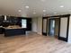 Open living space with sliding barn doors and access to an outdoor deck, blending indoor and outdoor living at 258 Riverwood Dr, Noblesville, IN 46062