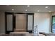 Bright living room with modern sliding doors and wood-look vinyl floors at 258 Riverwood Dr, Noblesville, IN 46062