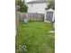 Lush backyard with a wooden fence, play set, and storage shed, perfect for outdoor activities and storage at 2637 Grand Fir Dr, Greenwood, IN 46143