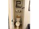 Bright bathroom features a toilet, shelves, decor, and fixtures at 2637 Grand Fir Dr, Greenwood, IN 46143