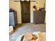 Bedroom view of a dark wood sliding barn door, decor, and dressers at 2637 Grand Fir Dr, Greenwood, IN 46143