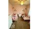 This charming bedroom features a pair of beds and plush stuffed animal decor at 2637 Grand Fir Dr, Greenwood, IN 46143