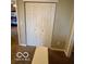Bright bedroom features a closet with double folding doors for optimal storage at 2637 Grand Fir Dr, Greenwood, IN 46143