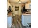 Efficient kitchen layout with modern appliances, white cabinets, and adjoining laundry area at 2637 Grand Fir Dr, Greenwood, IN 46143
