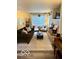 Inviting living room with a large window, fireplace, and cozy seating area at 2637 Grand Fir Dr, Greenwood, IN 46143