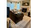 Comfortable living space featuring a fireplace, large windows, and stylish furnishings at 2637 Grand Fir Dr, Greenwood, IN 46143