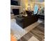 Cozy living room showcasing a fireplace, comfortable seating, and modern decor at 2637 Grand Fir Dr, Greenwood, IN 46143