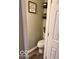 Small powder room featuring a toilet, tiled floors, and some decor at 2637 Grand Fir Dr, Greenwood, IN 46143