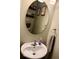 The powder room features a classic sink, mirror, and tiled floors at 2637 Grand Fir Dr, Greenwood, IN 46143