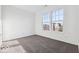 Bright bedroom with carpet flooring and natural light, featuring two windows at 284 N Bur Oak Dr, Mooresville, IN 46158