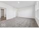 Bright bedroom with carpet flooring, two windows, and an en suite bathroom with a walk-in closet at 284 N Bur Oak Dr, Mooresville, IN 46158