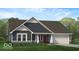 Charming single-Gathering home featuring a two-car garage, landscaped front yard, and inviting entrance at 284 N Bur Oak Dr, Mooresville, IN 46158