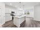 Stylish kitchen with stainless steel appliances, a center island, and bright countertops for a modern feel at 284 N Bur Oak Dr, Mooresville, IN 46158