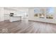 Modern kitchen featuring stainless steel appliances, a center island, and sleek countertops for easy cooking at 284 N Bur Oak Dr, Mooresville, IN 46158