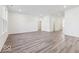 Open-concept living space featuring hard surface floors, recessed lighting, and a view into the kitchen at 284 N Bur Oak Dr, Mooresville, IN 46158