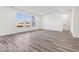 Spacious living room with windows offering ample natural light and hard surface flooring throughout at 284 N Bur Oak Dr, Mooresville, IN 46158
