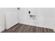 Well organized utility room with plank flooring and easy-access connections at 284 N Bur Oak Dr, Mooresville, IN 46158