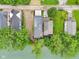 Birds eye view of the modern flat roof home with lake access at 2841 Tropical Dr, Indianapolis, IN 46205