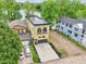 Stunning aerial view of a lakeside property showcasing architectural details, landscaping, and a serene waterfront at 2841 Tropical Dr, Indianapolis, IN 46205