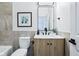 A modern bathroom features a stylish vanity with a marble countertop, sleek fixtures, and tasteful decor at 2841 Tropical Dr, Indianapolis, IN 46205