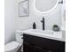 Stylish half-bathroom features a modern vanity with vessel sink and backlit mirror at 2841 Tropical Dr, Indianapolis, IN 46205