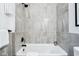 Well-lit bathroom features a shower and tiled walls at 2841 Tropical Dr, Indianapolis, IN 46205