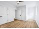 A simple bedroom design with a ceiling fan and two doors, creating a serene atmosphere at 2841 Tropical Dr, Indianapolis, IN 46205