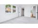 Bright bedroom with ample natural light, plush carpeting, a walk-in closet, and a neutral color palette at 2841 Tropical Dr, Indianapolis, IN 46205