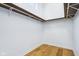 Empty walk-in closet showing built-in shelving for optimal storage at 2841 Tropical Dr, Indianapolis, IN 46205