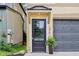 View of the home's entry way, and its black front door at 2841 Tropical Dr, Indianapolis, IN 46205