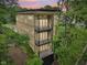 Modern home boasts balconies on each level with tree views at 2841 Tropical Dr, Indianapolis, IN 46205