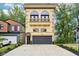 Beautiful three-story home with a balcony and a paved driveway at 2841 Tropical Dr, Indianapolis, IN 46205