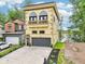 Beautiful home with detailed exterior, a gray garage door, black-framed windows, and a charming second-floor balcony at 2841 Tropical Dr, Indianapolis, IN 46205