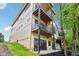 Modern home exterior with multi-level decks, offering outdoor living space and hillside views at 2841 Tropical Dr, Indianapolis, IN 46205