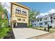 Stunning three-story home featuring a balcony and spacious driveway at 2841 Tropical Dr, Indianapolis, IN 46205