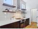 Kitchen countertop and cabinets featuring stainless steel appliances and light streaming through the window at 2841 Tropical Dr, Indianapolis, IN 46205