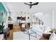 Open concept living area showcasing modern design, stylish lighting, and a seamless flow to the kitchen and staircase at 2841 Tropical Dr, Indianapolis, IN 46205