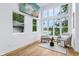 Bright living room boasts floor-to-ceiling windows and neutral decor at 2841 Tropical Dr, Indianapolis, IN 46205