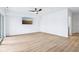 Bright living room with wood-look floors and sliding glass doors to a patio at 2841 Tropical Dr, Indianapolis, IN 46205