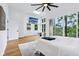 Bright main bedroom with scenic views, balcony, and tv at 2841 Tropical Dr, Indianapolis, IN 46205
