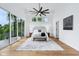 Bright main bedroom featuring balcony, ceiling fan, and ample natural light at 2841 Tropical Dr, Indianapolis, IN 46205