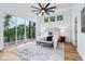 Spacious main bedroom featuring balcony, ceiling fan, and ample natural light at 2841 Tropical Dr, Indianapolis, IN 46205