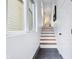 An elegant marble tiled entry and staircase up to the second story at 2841 Tropical Dr, Indianapolis, IN 46205