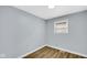 Bedroom with fresh paint, new window, and updated vinyl plank flooring at 3106 N Harding St, Indianapolis, IN 46208