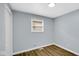 Bedroom features a new closet, fresh paint, and modern vinyl plank flooring at 3106 N Harding St, Indianapolis, IN 46208